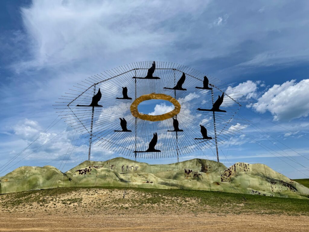 The sculpture is from the Enchanted Highway. It has geese flying through an eye. 