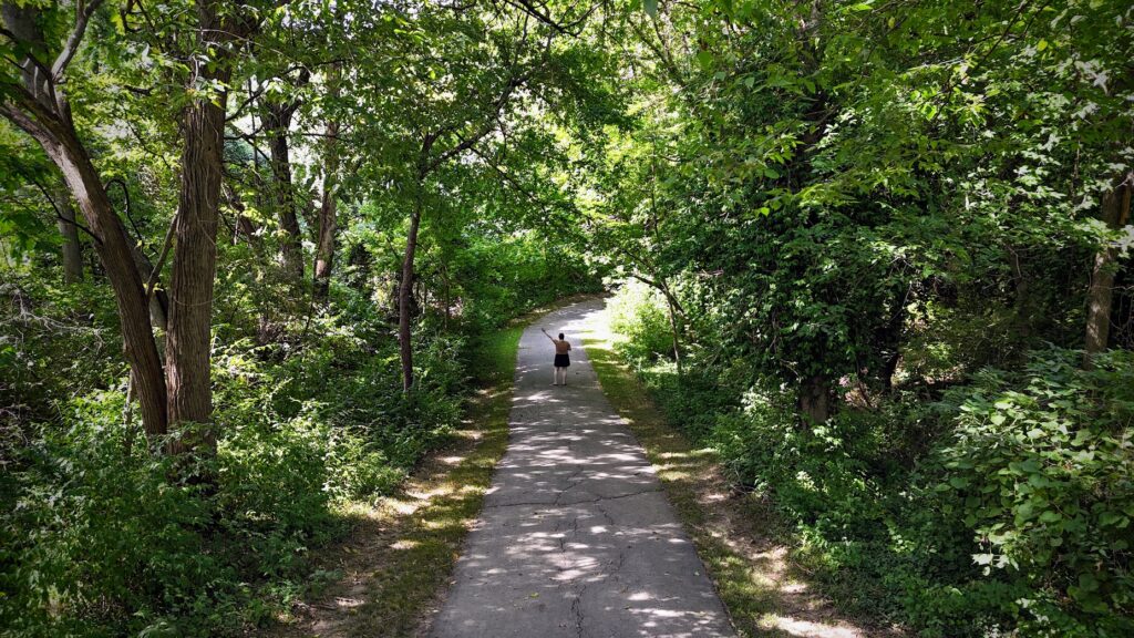 Me walking down a trail at Cate's Creek, a park in Liberty, Missouri